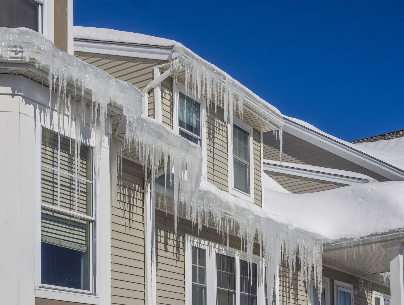 FAQ’s About Ice & Snow On Your Roof & Gutters