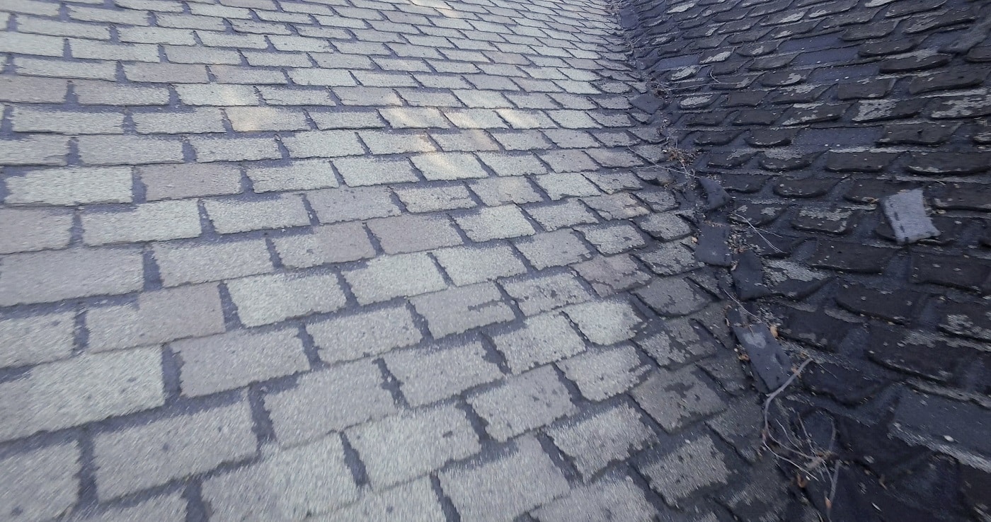  Damaged roofing shingles on a home
