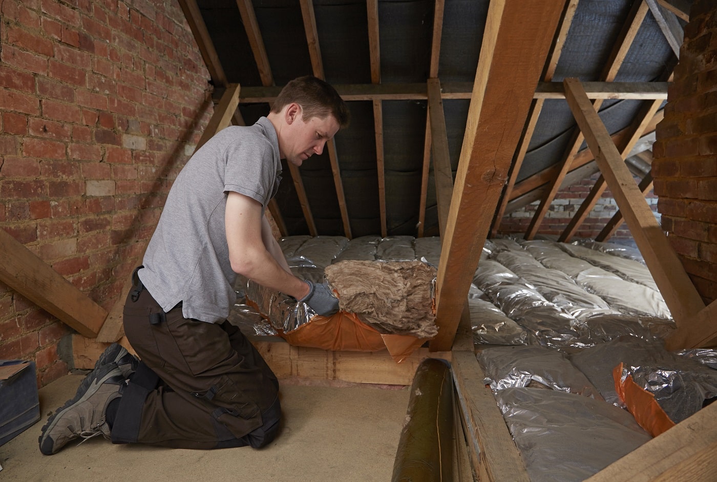 Insulation being installed in an attic