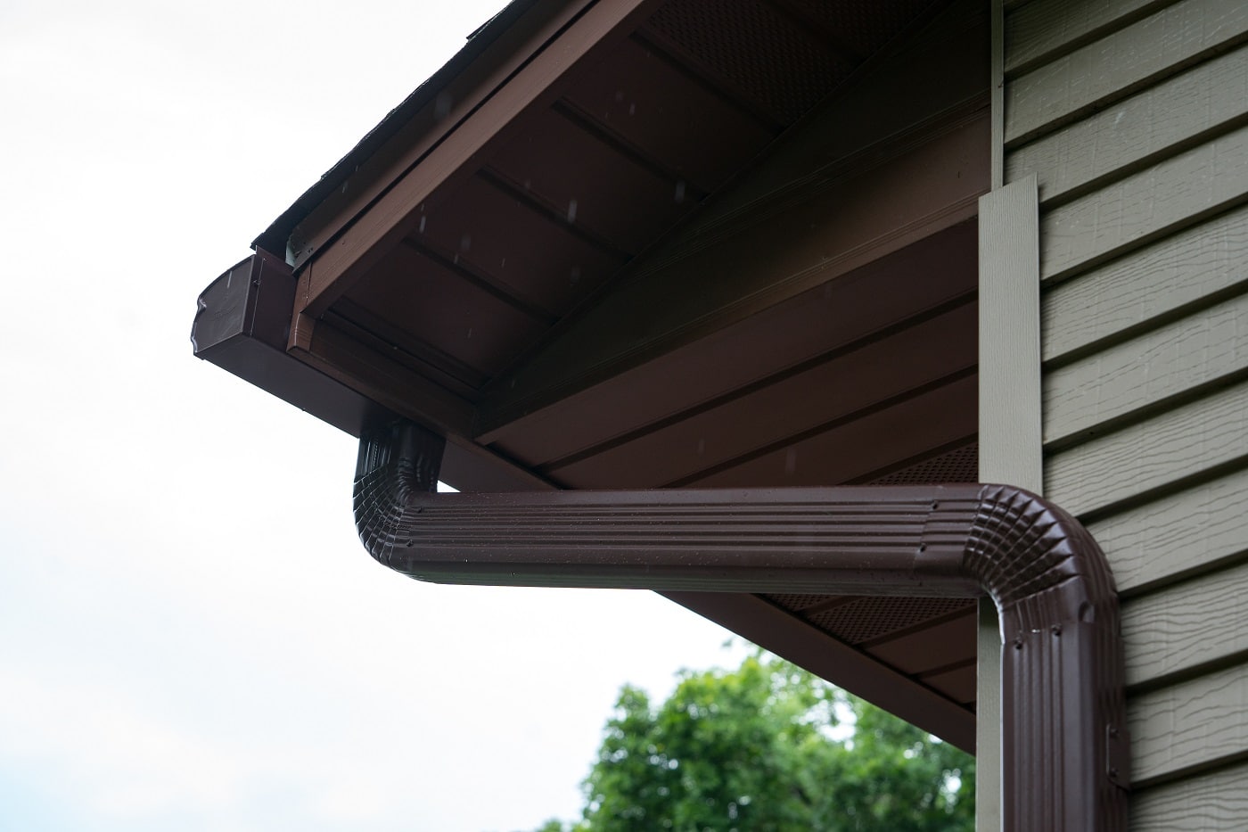 new gutters with gutter guards and downspouts