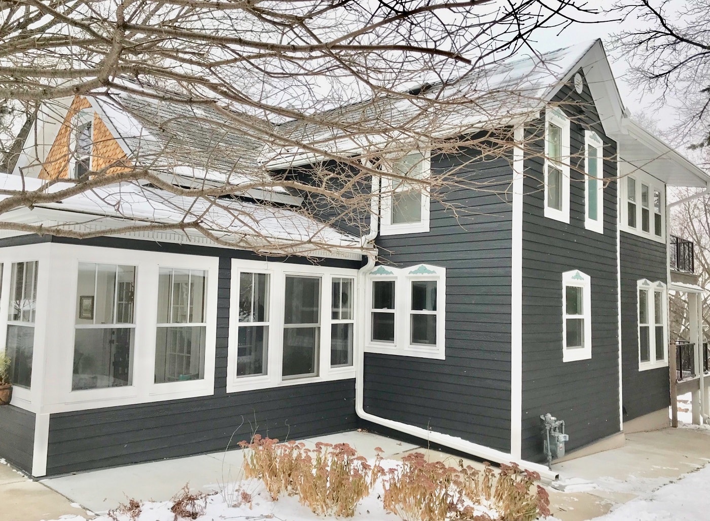 Gray siding on a home in winter 