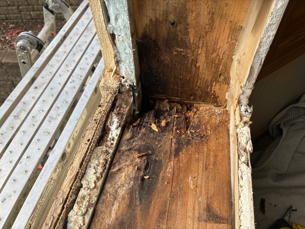 Rotted wood framing around a window caused by long-term moisture intrusion