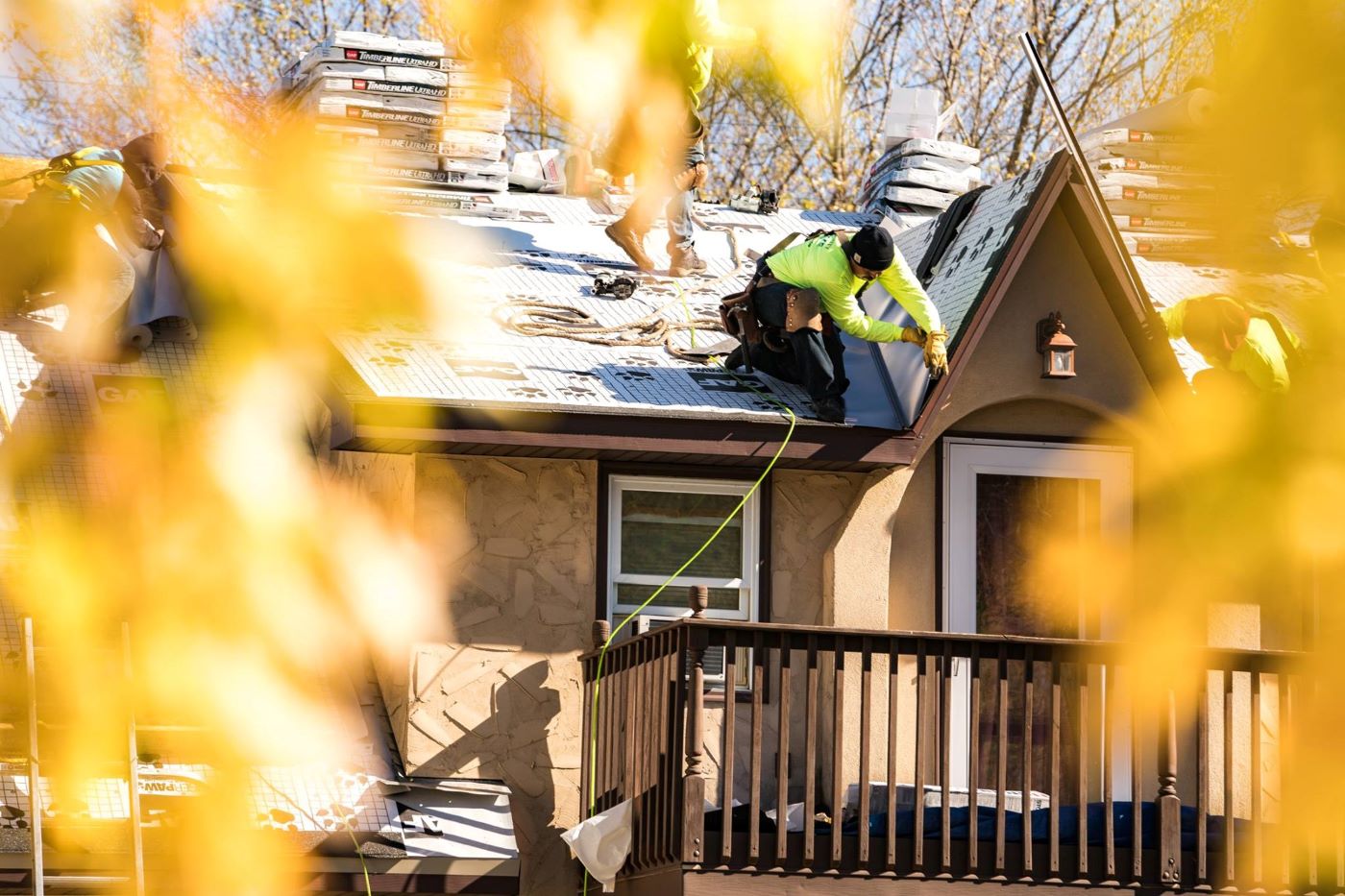Roofer Installing Shingles on a Home