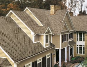 Picture of newly installed shingle roofing on a house.