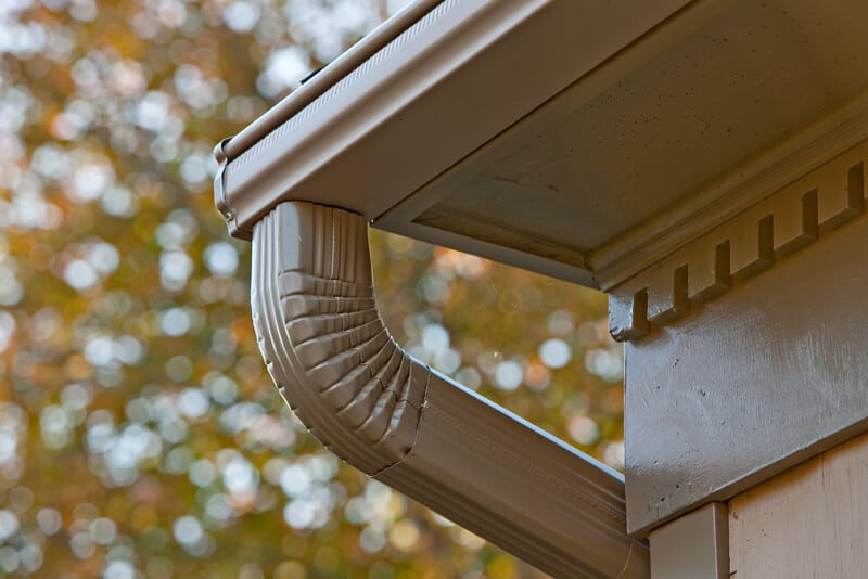 Picture of aluminum LeafGuard® Brand Gutters on the corner of a house.