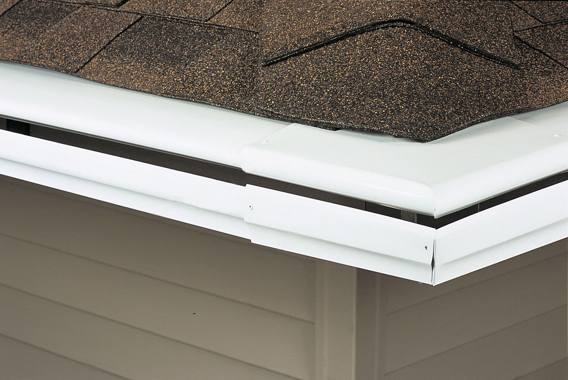 Picture of LeafGuard® Brand Gutters on the corner of a roof.